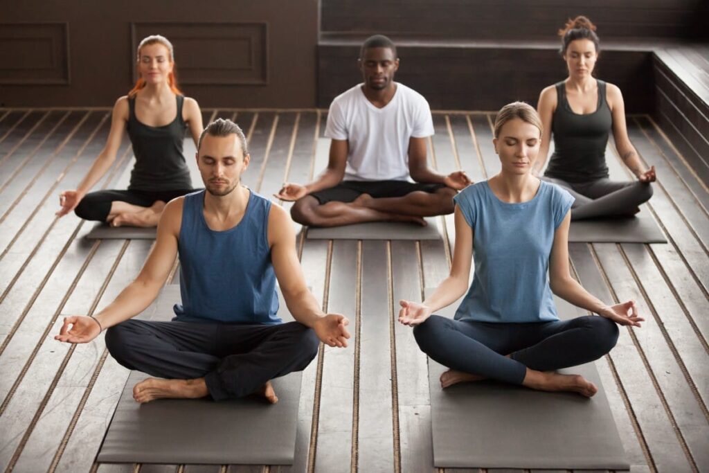 Group Young Yogi People Sitting Sukhasana Exercise 1 1024x683